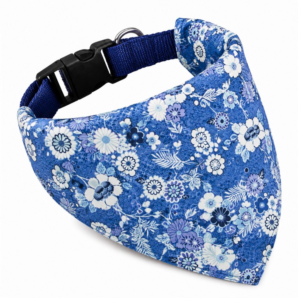 Golden Retriever wearing blue floral dog bandana scarf on outdoor walk