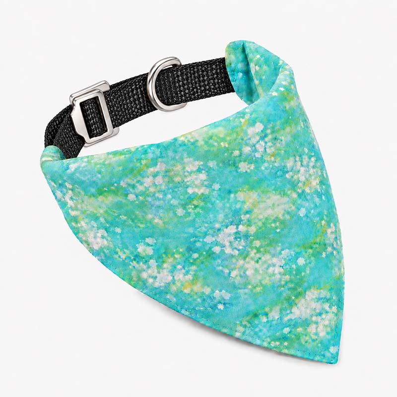 Green floral dog bandana with a black UHMWPE collar and Aircraft-Grade Aluminum buckle