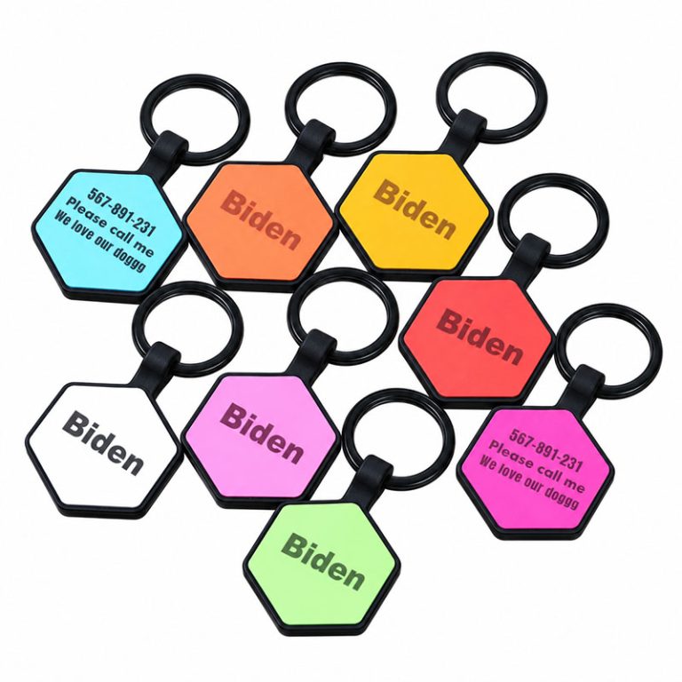 Hexagon silicone dog ID tags in assorted colors with black borders and sample personalization